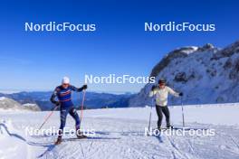 12.10.2024, Ramsau am Dachstein, Austria (AUT): Patrick Favre (ITA), coach Team France, Sophie Chauveau (FRA), (l-r) - Biathlon summer training, Dachsteinglacier, Ramsau am Dachstein (AUT). www.nordicfocus.com. © Manzoni/NordicFocus. Every downloaded picture is fee-liable.