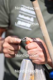 20.05.2024, Lenzerheide, Switzerland (SUI): Andreas Kuppelwieser (ITA), coach Team Switzerland, works on ski roller poles  - Biathlon summer training, Lenzerheide (SUI). www.nordicfocus.com. © Manzoni/NordicFocus. Every downloaded picture is fee-liable.