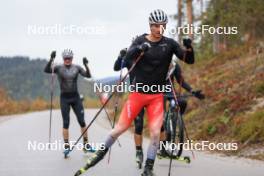 13.10.2024, Ramsau am Dachstein, Austria (AUT): Kein Einaste (EST), coach Team Switzerland, Sebastian Stalder (SUI), Joscha Burkhalter (SUI), Niklas Hartweg (SUI), (l-r) - Biathlon summer training, Ramsau am Dachstein (AUT). www.nordicfocus.com. © Manzoni/NordicFocus. Every downloaded picture is fee-liable.