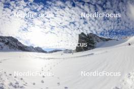 14.10.2024, Ramsau am Dachstein, Austria (AUT): Event Feature: Overview over the glacier track with clouds in the sky  - Biathlon summer training, Dachsteinglacier, Ramsau am Dachstein (AUT). www.nordicfocus.com. © Manzoni/NordicFocus. Every downloaded picture is fee-liable.