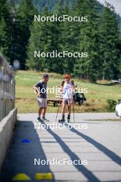 28.08.2024, Bessans, France (FRA): Cyril Burdet (FRA), Coach Team France, Justine Braisaz-Bouchet (FRA), (l-r) - Biathlon summer training, Bessans (FRA). www.nordicfocus.com. © Authamayou/NordicFocus. Every downloaded picture is fee-liable.