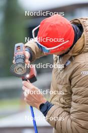 15.09.2024, Lenzerheide, Switzerland (SUI): Kein Einaste (EST), coach Team Switzerland, sharpens a roller ski pole - Sommer Nordic Event 2024, Sommer Biathlon Cup, Lenzerheide (SUI). www.nordicfocus.com. © Manzoni/NordicFocus. Every downloaded picture is fee-liable.