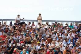 31.08.2024, Annecy, France (FRA): Event Feature: Fans with flags on the grandstand - Martin Fourcade Nordic Festival Biathlon, Annecy (FRA). www.nordicfocus.com. © Manzoni/NordicFocus. Every downloaded picture is fee-liable.