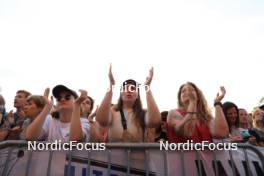 30.08.2024, Annecy, France (FRA): Event Feature: Fans with flags on the grandstand - Martin Fourcade Nordic Festival Biathlon, Annecy (FRA). www.nordicfocus.com. © Manzoni/NordicFocus. Every downloaded picture is fee-liable.