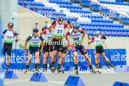 22.08.2024, Otepaeae, Estonia (EST): Simon Adamov (SVK), Laszlo Kunos (HUN), Konrad Badacz (POL), Andreas Aas (NOR), (l-r) - IBU Summer Biathlon World Championships, super sprint junior men, Otepaeae (EST). www.nordicfocus.com. © Manzoni/NordicFocus. Every downloaded picture is fee-liable.