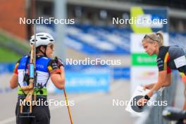 21.08.2024, Otepaeae, Estonia (EST): Lotte Lie (BEL), Margit Soerensen (NOR), coach Team Belgium (l-r) - IBU Summer Biathlon World Championships, training, Otepaeae (EST). www.nordicfocus.com. © Manzoni/NordicFocus. Every downloaded picture is fee-liable.