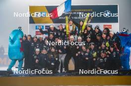 15.02.2024, Nove Mesto na Morave, Czechia (CZE): Tommaso Giacomel (ITA), Lisa Vittozzi (ITA) and  team France, (l-r) - IBU World Championships Biathlon, medals, Nove Mesto na Morave (CZE). www.nordicfocus.com. © Thibaut/NordicFocus. Every downloaded picture is fee-liable.