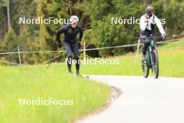 28.05.2024, Lenzerheide, Switzerland (SUI): Janik Riebli (SUI), Erik Braten Guidon (NOR), coach Team Switzerland, (l-r) - Cross-Country training, Lenzerheide (SUI). www.nordicfocus.com. © Manzoni/NordicFocus. Every downloaded picture is fee-liable.