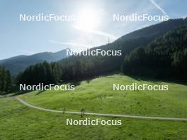 15.08.2024, Ulrichen, Switzerland (SUI): Event Feature: Overview over the Nordic Center Goms with parts of the track and undefined athletes compete - Cross-Country summer training, Ulrichen (SUI). www.nordicfocus.com. © Manzoni/NordicFocus. Every downloaded picture is fee-liable.