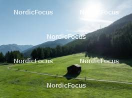 15.08.2024, Ulrichen, Switzerland (SUI): Event Feature: Overview over the Nordic Center Goms with parts of the track and undefined athletes compete - Cross-Country summer training, Ulrichen (SUI). www.nordicfocus.com. © Manzoni/NordicFocus. Every downloaded picture is fee-liable.