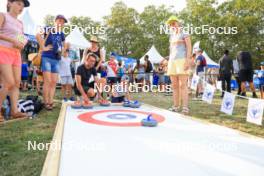 30.08.2024, Annecy, France (FRA): Event Feature: Kid plays curling - Martin Fourcade Nordic Festival Cross-Country, Annecy (FRA). www.nordicfocus.com. © Manzoni/NordicFocus. Every downloaded picture is fee-liable.