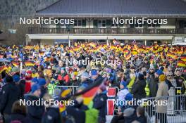 01.01.2024, Garmisch, Germany (GER): German spectators with their flag - FIS world cup ski jumping men, four hills tournament, individual HS142, Garmisch (GER). www.nordicfocus.com. © Reichert/NordicFocus. Every downloaded picture is fee-liable.