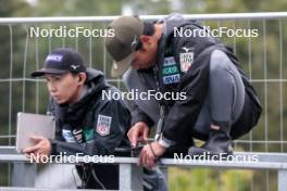 27.09.2024, Hinzenbach, Austria (AUT): Japanese Coaches (JPN)  - Summer Grand Prix ski jumping, training HS90, Hinzenbach (AUT). www.nordicfocus.com. © Volk/NordicFocus. Every downloaded picture is fee-liable