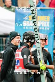 06.10.2024, Klingenthal, Germany (GER): Ari Repellin (FRA), Valentin Foubert (FRA), Josephine Pagnier (FRA), (l-r)  - Summer Grand Prix ski jumping, mixed team HS140, Klingenthal (GER). www.nordicfocus.com. © Volk/NordicFocus. Every downloaded picture is fee-liable