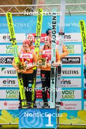 06.10.2024, Klingenthal, Germany (GER): Katharina Schmid (GER), Pius Paschke (GER), Selina Freitag (GER), Andreas Wellinger (GER), (l-r)  - Summer Grand Prix ski jumping, mixed team HS140, Klingenthal (GER). www.nordicfocus.com. © Volk/NordicFocus. Every downloaded picture is fee-liable