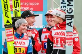 06.10.2024, Klingenthal, Germany (GER): Jacqueline Seifriedsberger (AUT), Jan Hoerl (AUT), Lisa Eder (AUT), Daniel Tschofenig (AUT), (l-r)  - Summer Grand Prix ski jumping, mixed team HS140, Klingenthal (GER). www.nordicfocus.com. © Volk/NordicFocus. Every downloaded picture is fee-liable