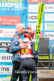 06.10.2024, Klingenthal, Germany (GER): Pius Paschke (GER), Katharina Schmid (GER), (l-r)  - Summer Grand Prix ski jumping, mixed team HS140, Klingenthal (GER). www.nordicfocus.com. © Volk/NordicFocus. Every downloaded picture is fee-liable