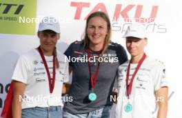 18.07.2024, Madona, Latvia (LAT): Medal ceremony, Kaidy Kaasiku (EST), Linn Soemskar (SWE), Keidy Kaasiku (EST) - FIS Rollerski World Cup, interval, Madona (LAT). www.nordicfocus.com. © Koksarovs/NordicFocus. Every downloaded picture is fee-liable.