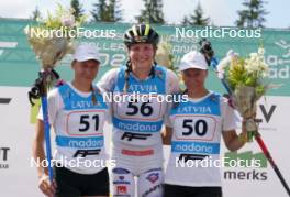 17.07.2024, Madona, Latvia (LAT): Flower ceremony, Kaidy Kaasiku (EST), Linn Soemskar (SWE), Keidy Kaasiku (EST) - FIS Rollerski World Cup, interval, Madona (LAT). www.nordicfocus.com. © Koksarovs/NordicFocus. Every downloaded picture is fee-liable.