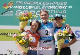 21.07.2024, Madona, Latvia (LAT): Flower ceremony, Anna Maria Ghiddi (ITA), Johanna Holmberg (SWE), Darya Kim (KAZ) - FIS Rollerski World Cup, mass, Madona (LAT). www.nordicfocus.com. © Koksarovs/NordicFocus. Every downloaded picture is fee-liable.