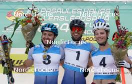 20.07.2024, Madona, Latvia (LAT): Flower ceremony, Michele Valerio (ITA), Emanuele Becchis (ITA), Lauris Kaparkalejs (LAT)- FIS Rollerski World Cup, sprint, Madona (LAT). www.nordicfocus.com. © Koksarovs/NordicFocus. Every downloaded picture is fee-liable.