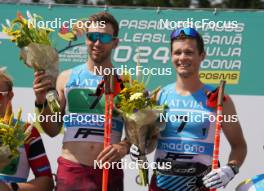 18.07.2024, Madona, Latvia (LAT): Flower ceremony, Raimo Vigants (LAT), Lauris Kaparkalejs (LAT) - FIS Rollerski World Cup, team sprint, Madona (LAT). www.nordicfocus.com. © Koksarovs/NordicFocus. Every downloaded picture is fee-liable.