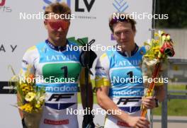 18.07.2024, Madona, Latvia (LAT): Flower ceremony, Simon Karlsson (SWE), Erik Fransson (SWE) - FIS Rollerski World Cup, team sprint, Madona (LAT). www.nordicfocus.com. © Koksarovs/NordicFocus. Every downloaded picture is fee-liable.