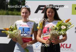 18.07.2024, Madona, Latvia (LAT): Flower ceremony, Daryna Myhal (UKR), Sofiia Shkatula (UKR), - FIS Rollerski World Cup, team sprint, Madona (LAT). www.nordicfocus.com. © Koksarovs/NordicFocus. Every downloaded picture is fee-liable.